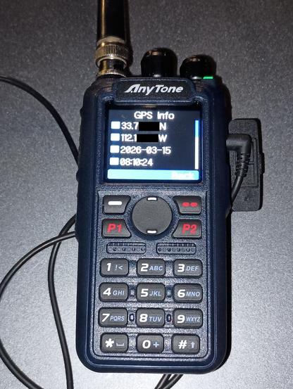 WD9EWK's Anytone AT-D890UV handheld 2m/70cm FM/DMR transceiver showing WD9EWK's location in grid DM33wr (with some digits in the latitude and longitude redacted), before an ISS pass around 0810 UTC on 15 March 2026.